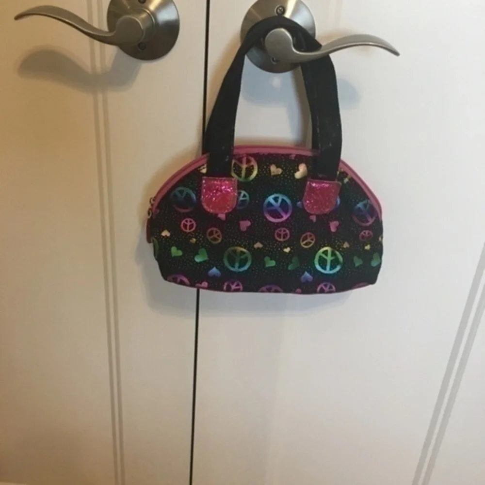 Little girls sparkly peace purse